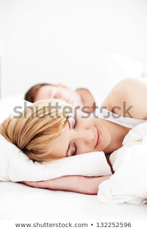 [[stock_photo]]: Closeup Portrait Of A Happy Young Couple Relaxing On The Bed Ma