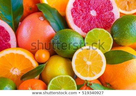 Stockfoto: Heap Of Orange Green And Yellow Lemon