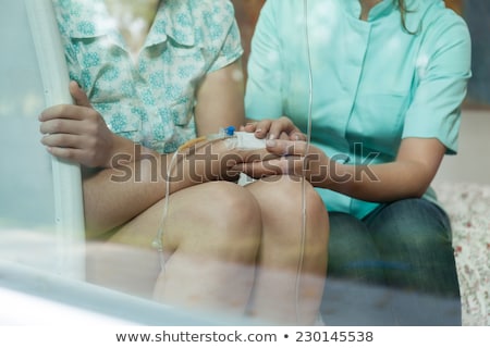 Stock photo: Nurse Holding A Drip Bag