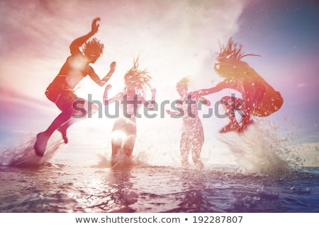 Stok fotoğraf: Boy Enjoys The Beautiful Water Of The Ocean