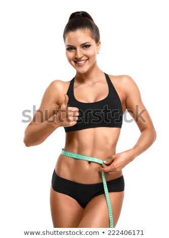 Cheerful Woman Measuring Her Waist And Showing Thumb Up Stok fotoğraf © restyler