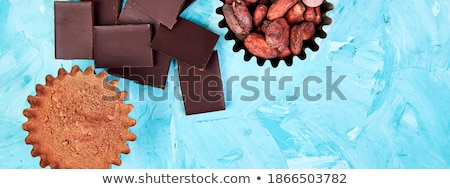 Stock photo: Cocoa Beans Background On Blue Table Dark Chocolate Pieces
