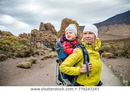 Foto d'archivio: Super Mom With Baby Boy Hiking In Backpack