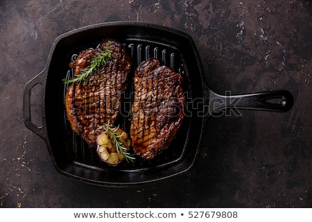 Foto stock: Steak Grill In The Cast Iron Grill Pan