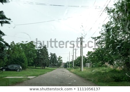 Foto stock: Rainy City Road Through The Windshild