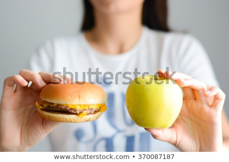 Stock photo: Woman Choosing Between Burger And Apple