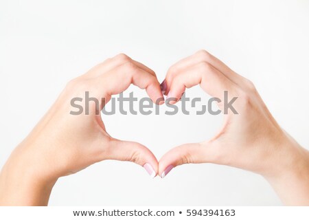 Stock photo: Woman Pointing Her Finger To The Heart