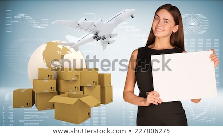 Businesswoman With Earth And Heap Of Cardboard Boxes Stockfoto © cherezoff
