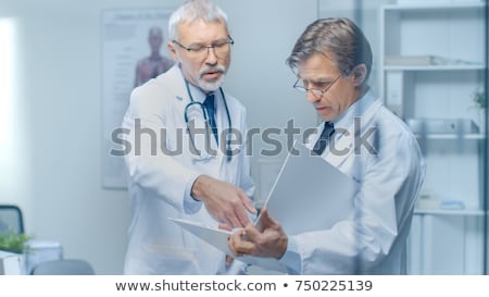 Stockfoto: Two Doctors Discussing Test Results
