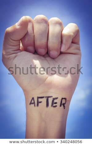 Foto stock: Young Man With The Word Swag Tattooed In His Fist With A Filter