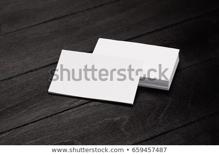 [[stock_photo]]: Stack Blank Corporate Identity Business Cards On Black Stylish Wood Background With Blur Mock Up