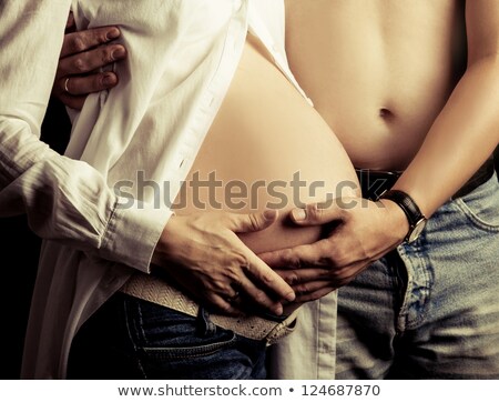 Сток-фото: Young Man And Pregnant Woman In Studio