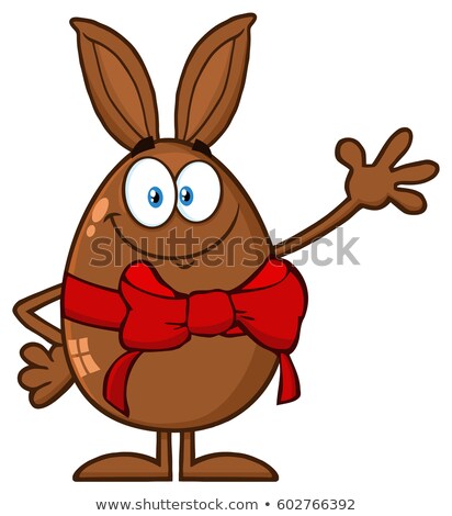 Foto d'archivio: Smiling Chocolate Egg Cartoon Mascot Character With A Rabbit Ears And Red Ribbon Waving For Greeting