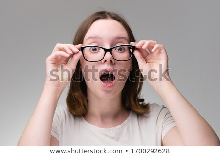 Foto stock: Young Brunette Girl With Glasses The Girl In Black Sight Glasses