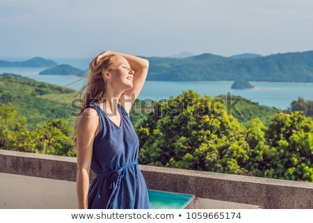 Foto stock: Young Woman In The Background Of Tropical Beach Landscape Panorama Beautiful Turquoise Ocean Waives