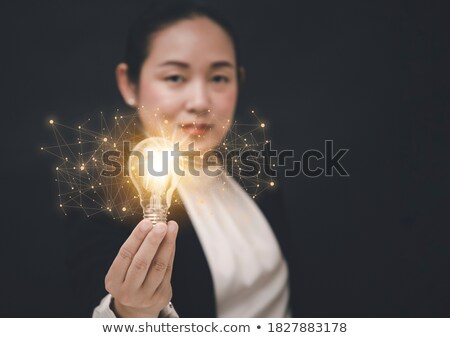 Stock fotó: Business Man Holding A Glass With Keys Icons