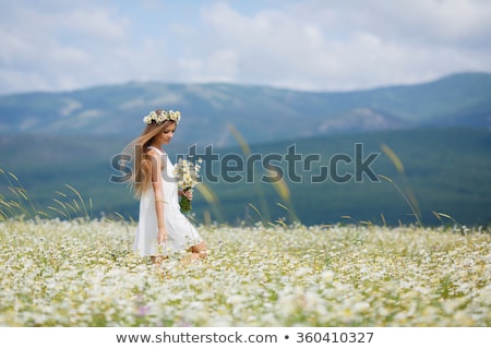 Stock photo: Pretty Girl On Flowers Meadow