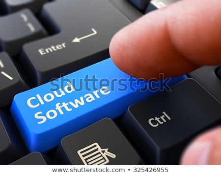 Foto d'archivio: Finger Presses Blue Keyboard Button Cloud Software