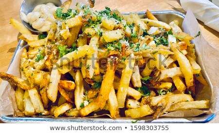 Foto stock: Tray Of Rustic Golden French Fries