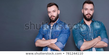 Foto stock: Portrait Of A Two Young Confident Twin Brothers