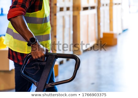 Foto stock: Close Up Of Forklift Loading Goods At Warehouse