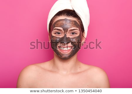 Stock photo: Woman Posing Isolated Over Pink Background Take Care Of Her Skin Holding Cream Lotion Gel