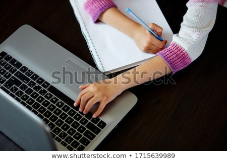 Сток-фото: Unrecognizable Schoolgirl Studying At Home With A Notebook And Doing School Homework