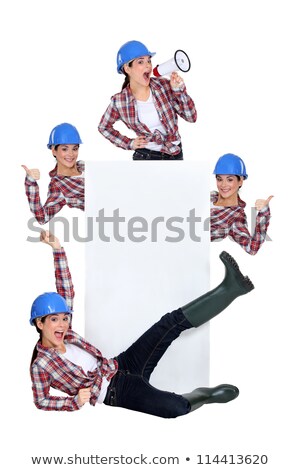 Foto d'archivio: Excited Construction Worker Publicizing A Blank Board