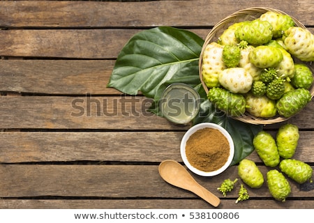 Stock fotó: Noni Fruit And Noni Powder On Wooden Tablefruit For Health And Herb For Health1