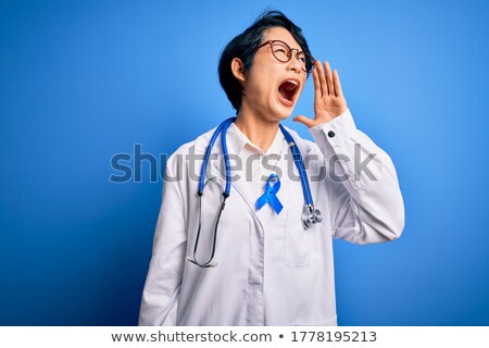 Foto stock: Young Asian Furious Doctor Screaming