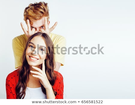 Foto stock: Young Pretty Teenage Couple Hipster Guy With His Girlfriend Happy Smiling And Hugging Isolated On W