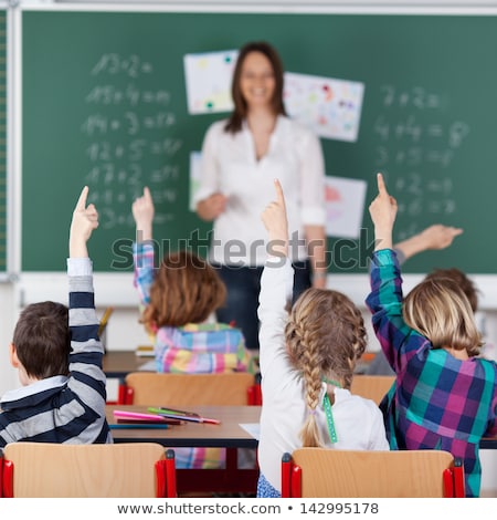 Zdjęcia stock: School Children Raising Their Hands