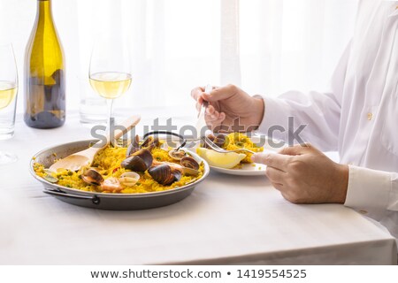 ストックフォト: Man With A Typical Spanish Paella Valenciana