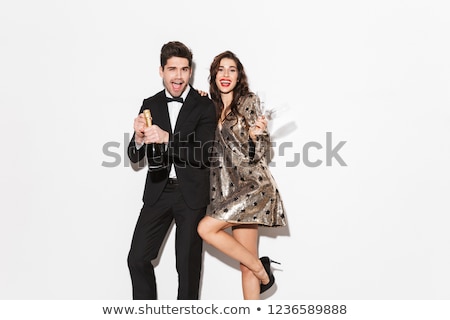 Foto stock: Cheerful Young Smartly Dressed Celebrating New Year