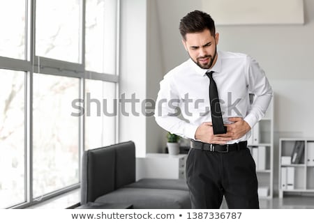 [[stock_photo]]: Businessman With Stomach Ache