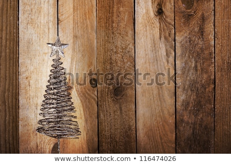 Foto stock: Christmas Greeting Card With Gold Metal Firtree On The Wooden Ba