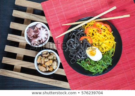 Stockfoto: Bowl Of Marinated Greek Salad With Red Napkin