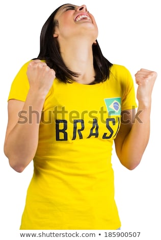 Stockfoto: Excited Football Fan In Brasil Tshirt