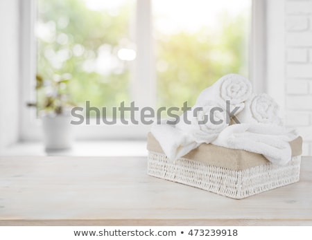 Beige And White Towel Over Table [[stock_photo]] © homydesign