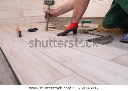 Foto stock: Laying Of Ceramic Tiles