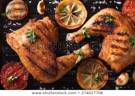 Foto stock: Two Roasted Chicken Drumstick