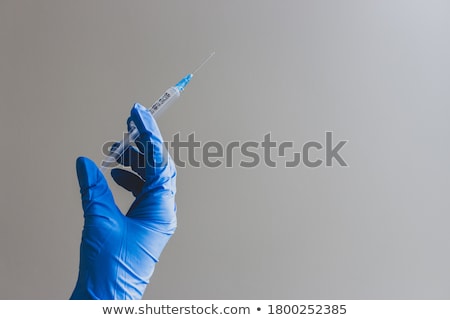 Foto stock: Hand With Syringe