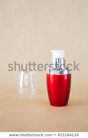Shiny Hard Red Bottle On Brown Background Stock foto © nalinratphi