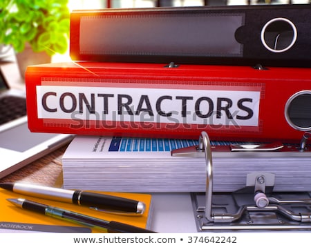 Stok fotoğraf: Contractors On File Folder Blurred Image