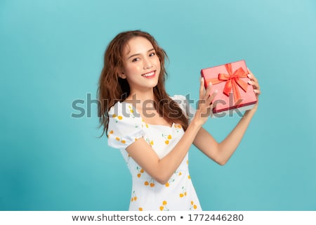 Foto stock: Excited Asian Beautiful Woman Isolated Over Blue Background Holding Passport With Tickets
