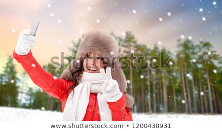 Stockfoto: Happy Woman Taking Selfie Over Winter Forest