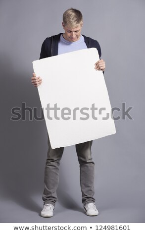 Stok fotoğraf: Man Showing Empty Signboard With Space For Text