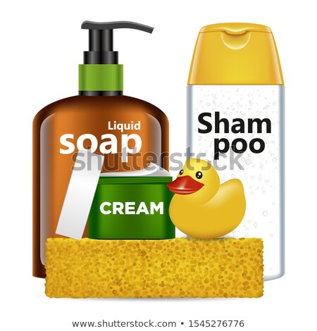 Foto stock: Vial Of The Shampoo And Yellow Sponge