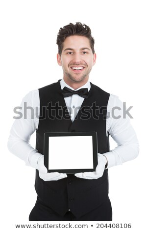 Foto stock: Butler Showing Digital Tablet