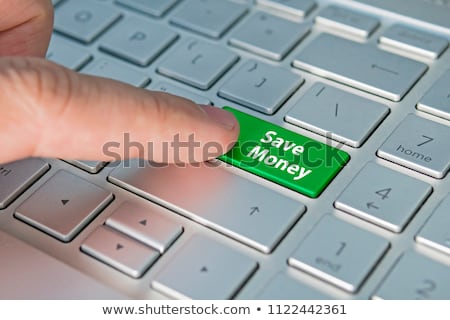 Foto stock: Pressing Green Button Hold On Black Keyboard